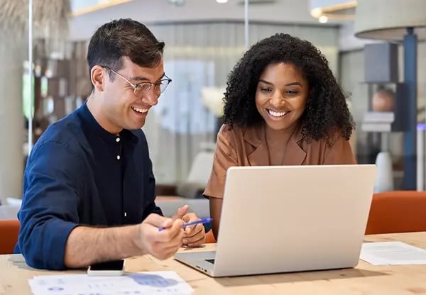 Happy workers on computer