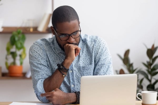 Man looking concerned at computer