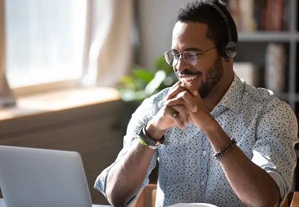 Man smiling on computer