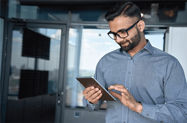 Man working on digital tablet