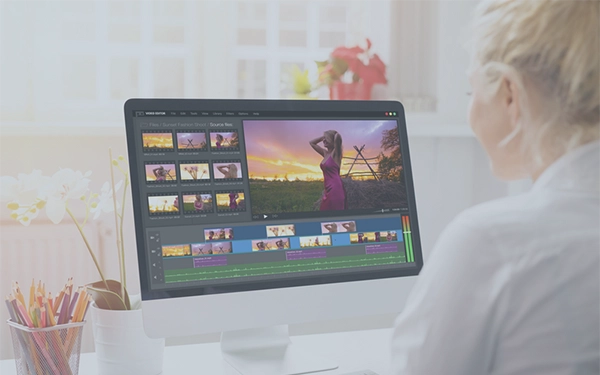 Woman working on photographs on computer